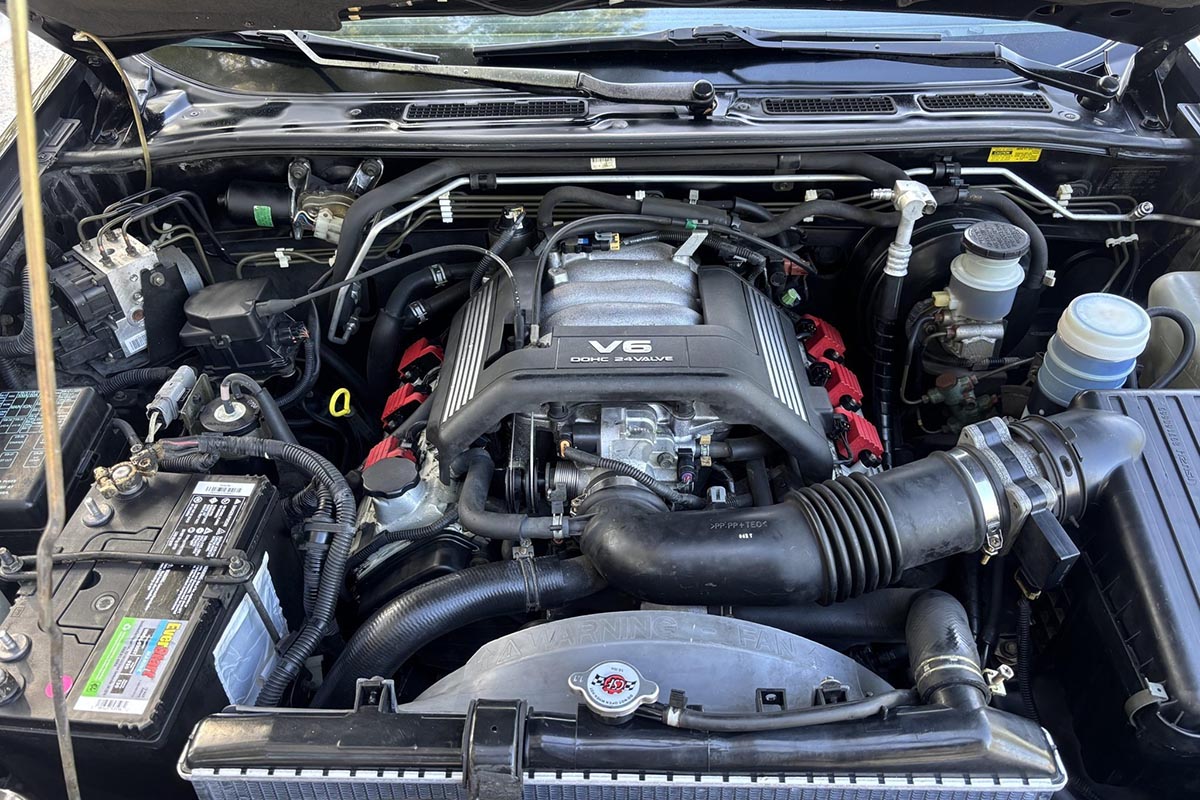 3.5-liter V6 engine of the Isuzu VehiCROSS with aluminum valve cover and central intake