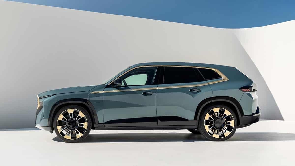 Profile of the BMW XM, high-performance plug-in hybrid SUV with muscular design