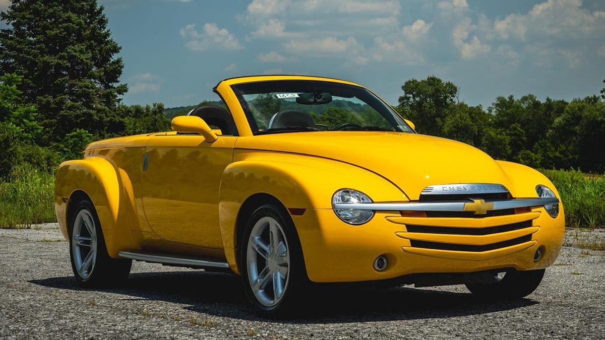 Front view of yellow Chevrolet SSR with chrome grille and round headlights
