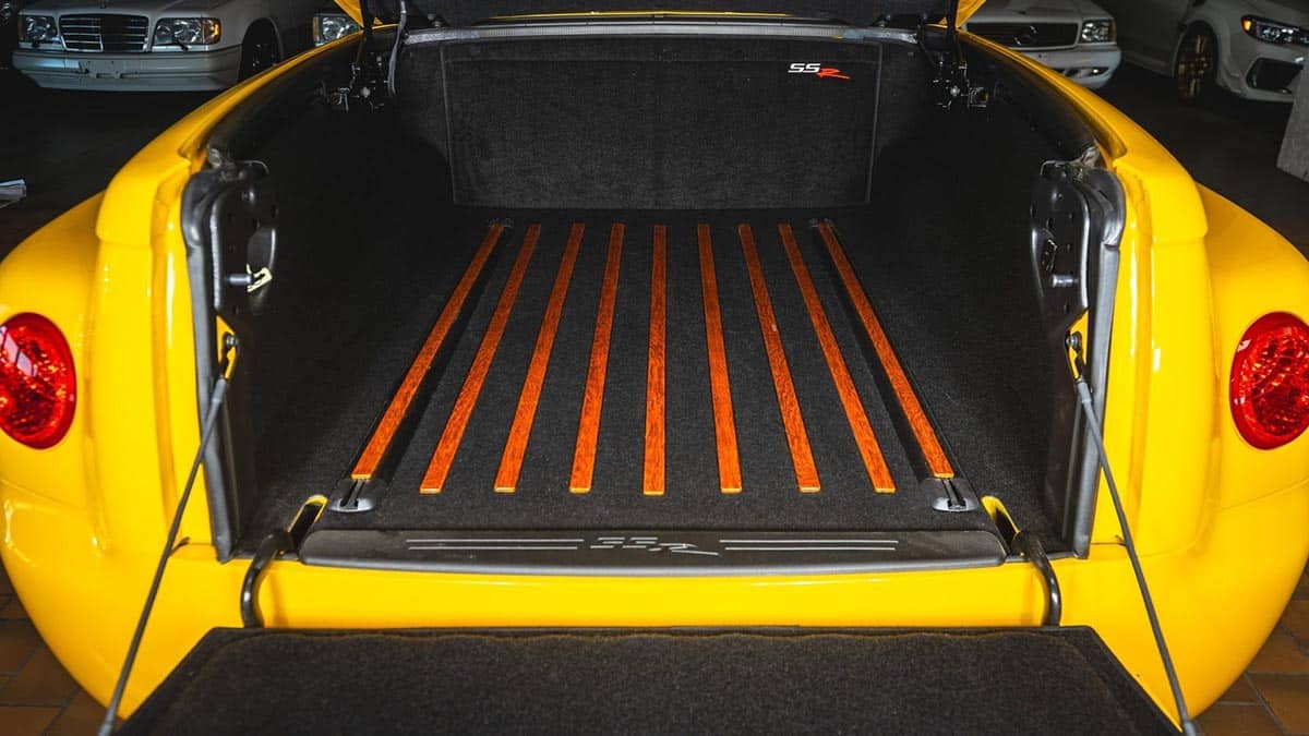 Rear bed of Chevrolet SSR covered by a painted rigid tonneau cover