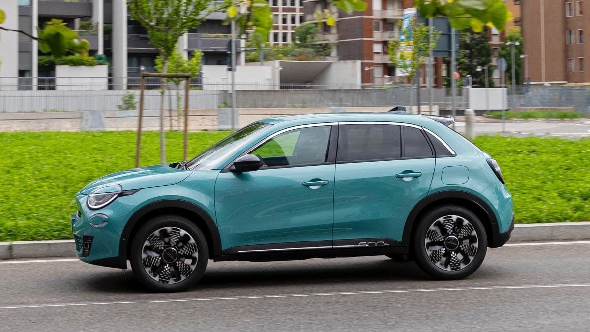 2025 Fiat 600 Hybrid profile view in Pop trim with pastel paint and 16-inch alloy wheels