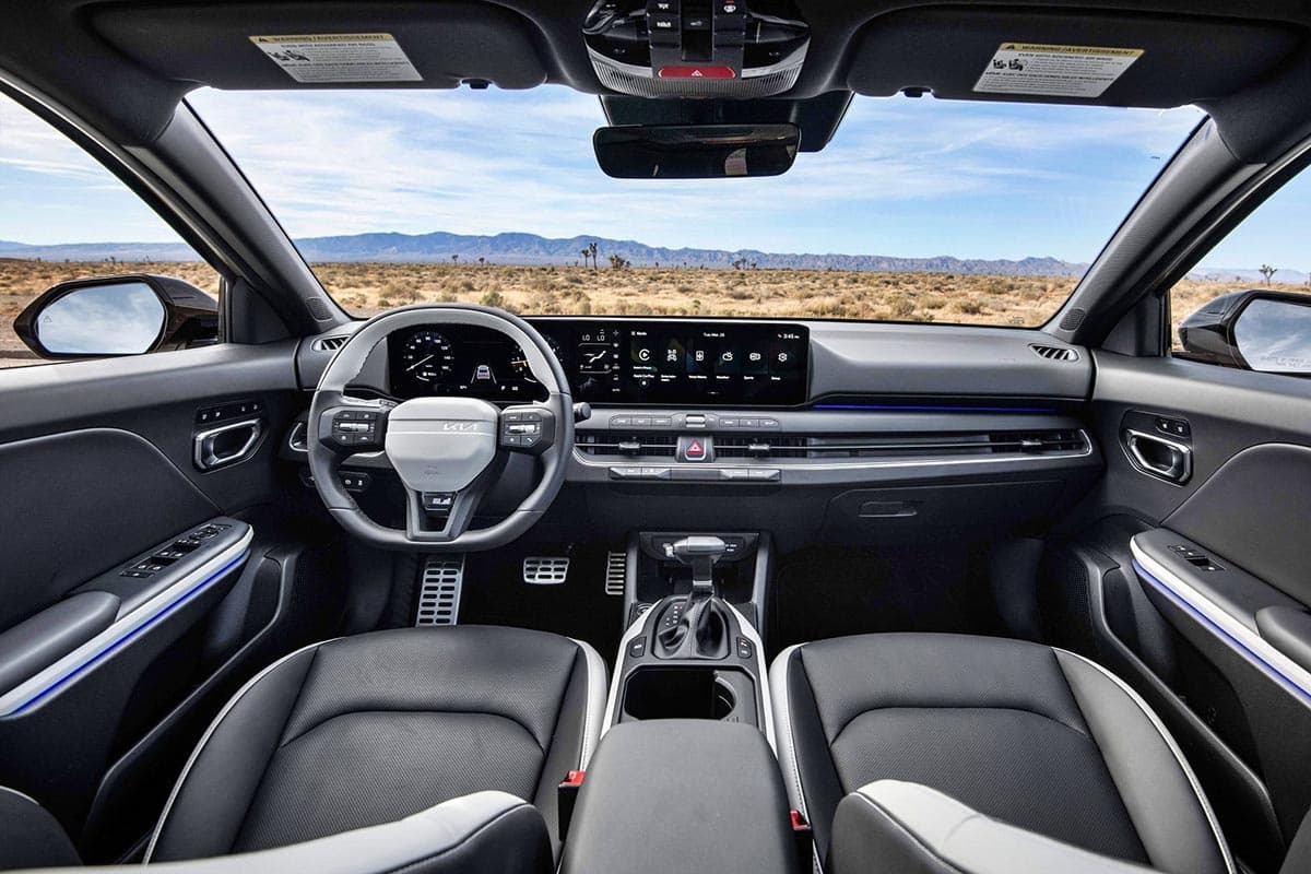 Interior of the Kia K4 with curved dual screen and clean dashboard