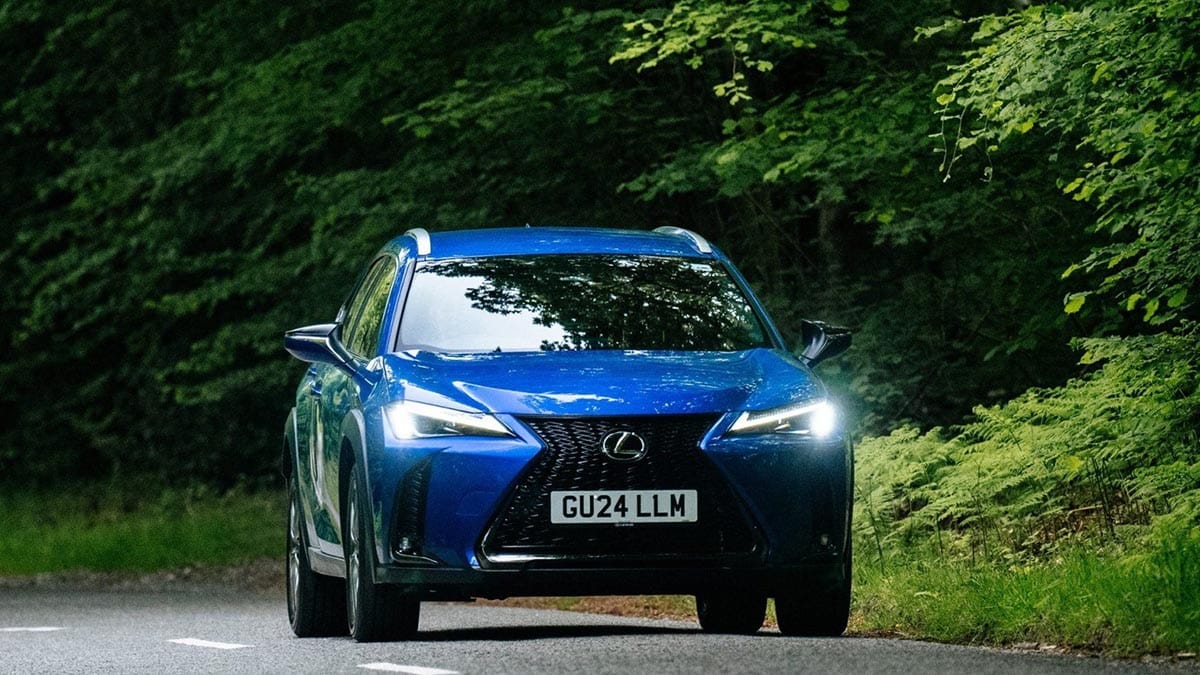 Front view of the 2026 Lexus UX with its trapezoidal grille and LED headlights