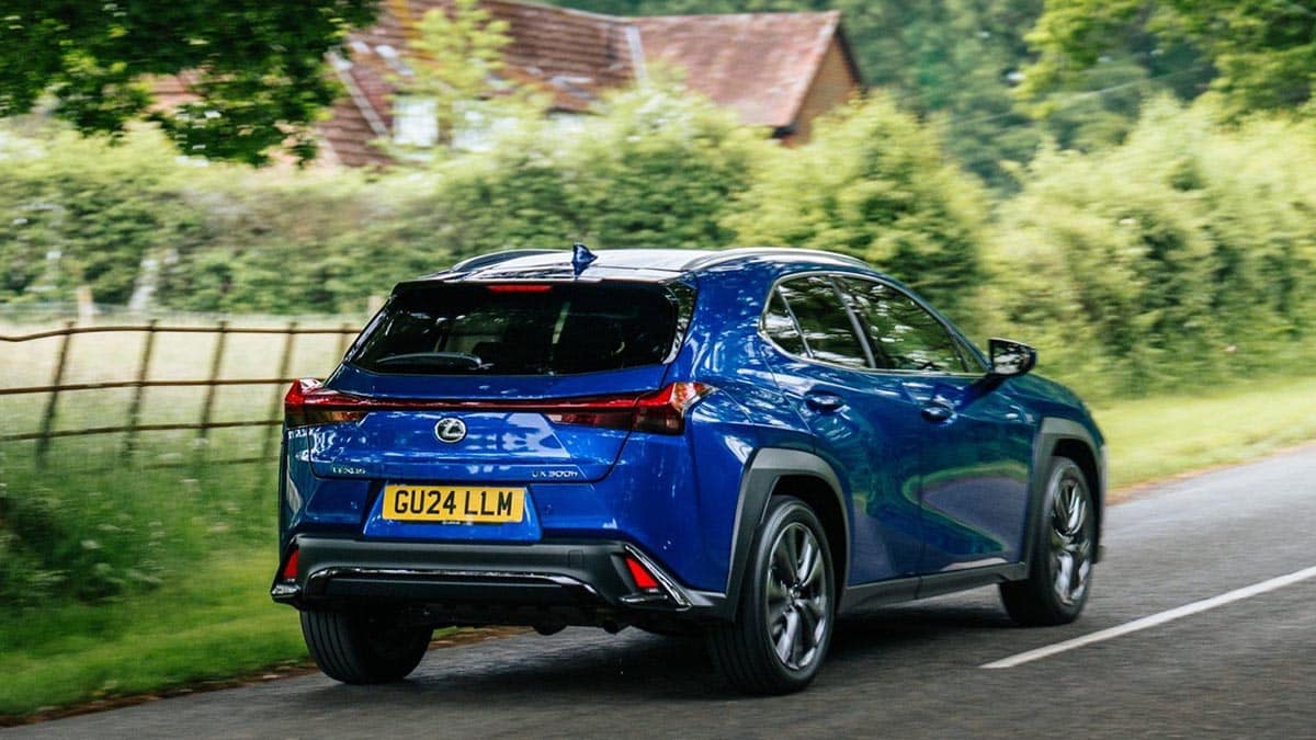 Rear of the 2026 Lexus UX hybrid with continuous light bar and central logo