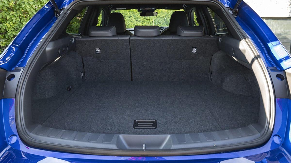 Open cargo area of the 2026 Lexus UX in standard configuration with flat floor