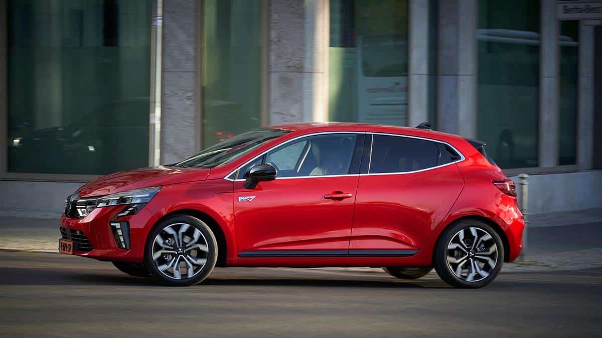 Side profile of the 2025 Mitsubishi Colt in Motion trim with 5 doors, red color, on urban background