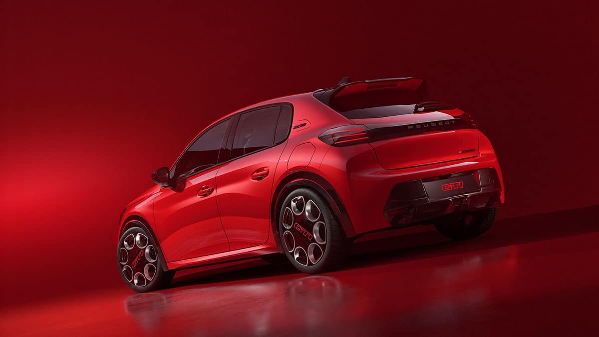Rear of the new 2025 Peugeot e-208 GTI with connected taillights linked by black strip and sporty diffuser