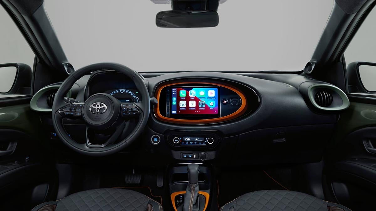 Interior of the Toyota Aygo X with central touchscreen and colorful dashboard